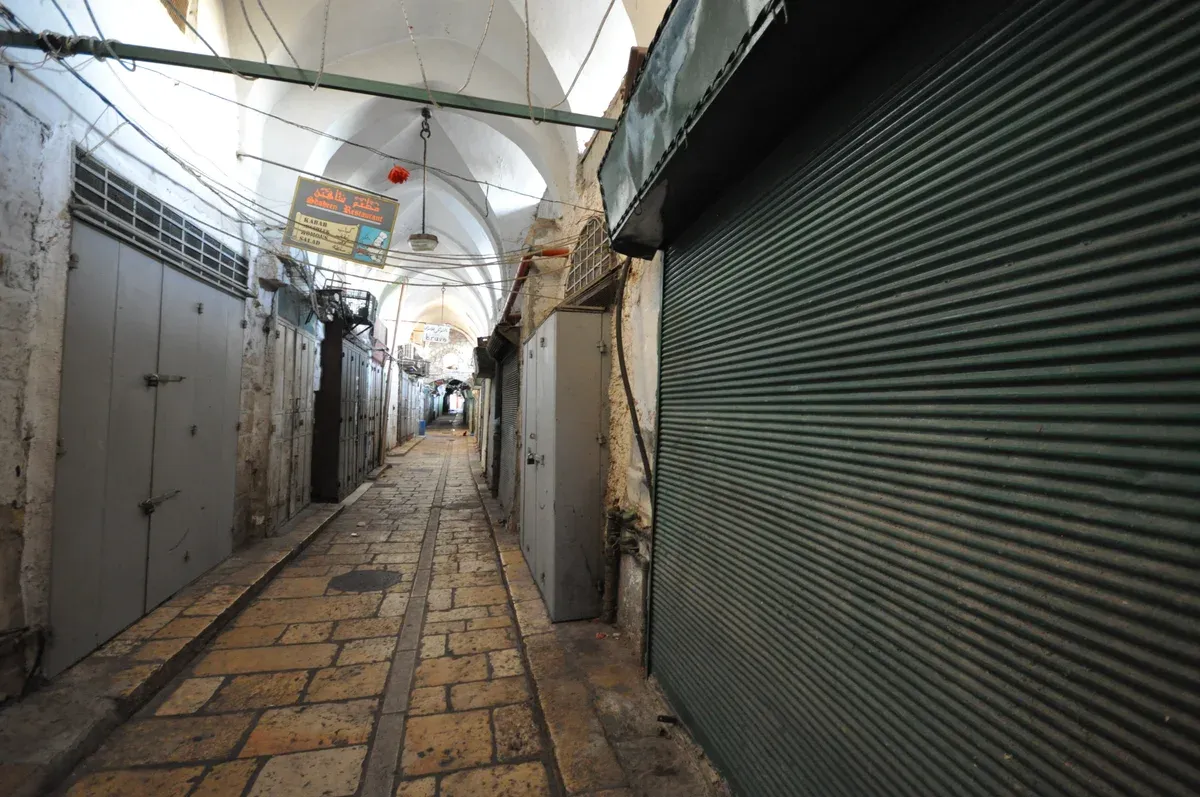 Covered market alley in the Old City of Jerusalem, on a Jerusalem Old City tour itinerary