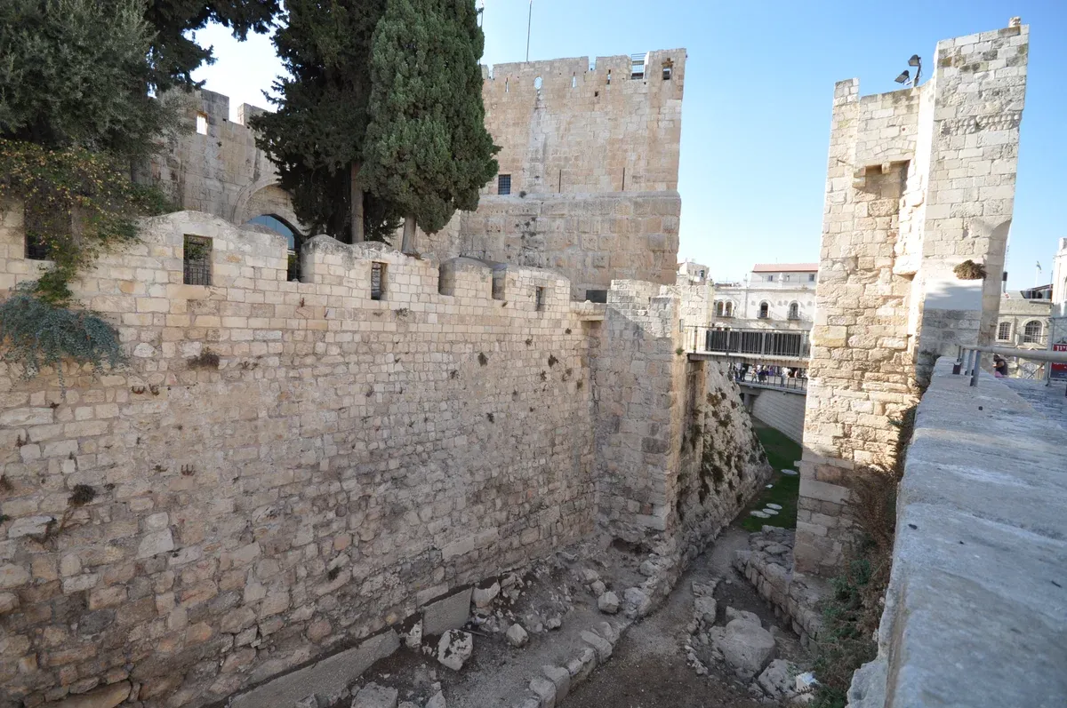 Citadel walls and moat beside Jaffa Gate on a half-day Jerusalem Old City tour
